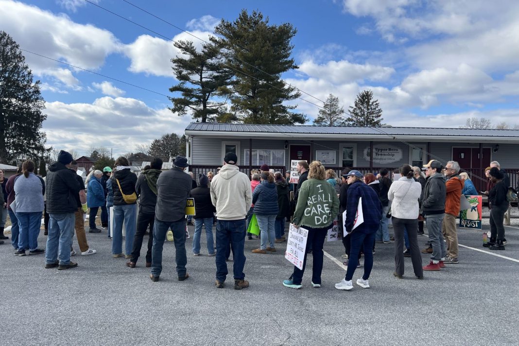 Roughly 100 people gathered at Upper Bern Township’s municipal building on Feb. 21 to protest a planned ICE detention center.