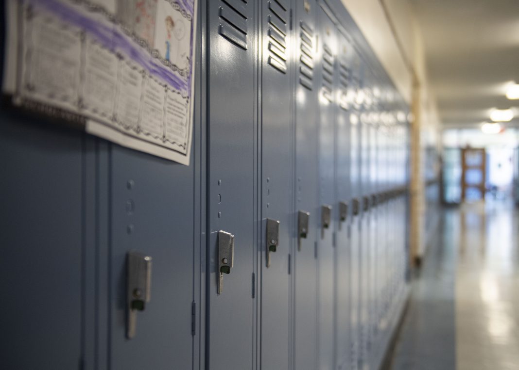 A row of lockers in a school hallway.