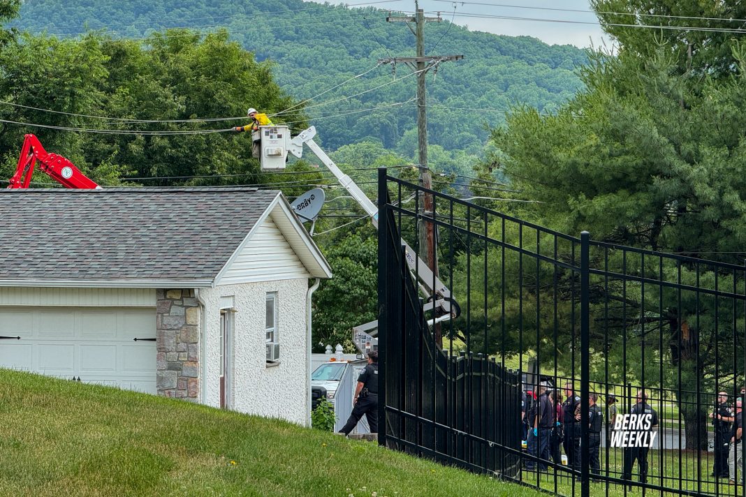 A Met-Ed crew works to de-energize power lines at the scene of a fatal workplace accident in Exeter Township on June 10, 2026.