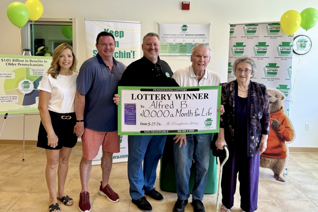 Kathy B.; Fred B.; PA Lottery Deputy Executive Director of Sales & Retail Operations Eric Grubbs; winner Alfred B.; and his wife, Shirley B.