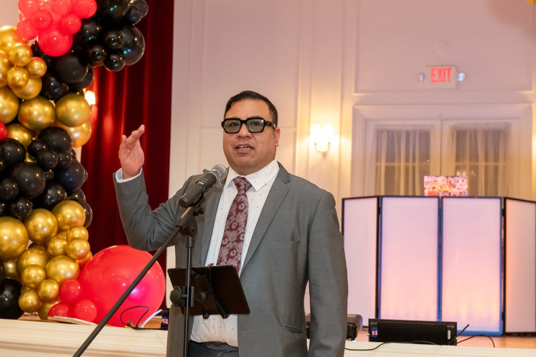 Daniel Egusquiza addressing a crowd at Barrio Alegria's 10th anniversary celebration.